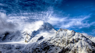 Mountain snow blue sky clouds 5 - snow under a blue sky free wallpaper