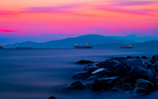 Mystical mountain shore sunset ship - a large ship free wallpaper