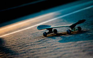 Skateboard beach ocean tiltshift shallowdepth - a blurry background free wallpaper