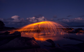 Firework night sky reflection water - a firework free wallpaper