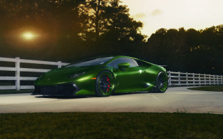 Green sports car night fence - a green sports car free wallpaper