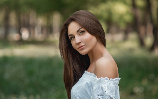 Romantic portrait woman park bokeh - the background and grass free wallpaper