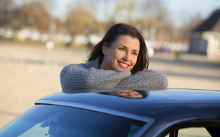 Woman smiling car bokeh photorealistic - the hood of a car free wallpaper