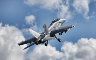 Fighter jet cloudy sky military - a cloudy blue sky free wallpaper