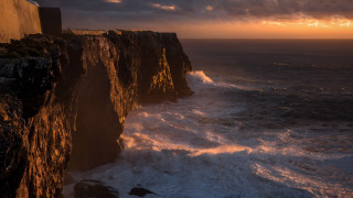 Cliff waves sunset clouds matte - dramatic light free wallpaper