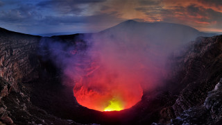 Lava crater glow mountains clouds - free mountains wallpaper