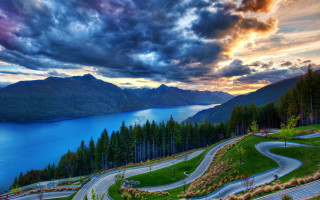 Scenic winding road lake sunset - a scenic view free wallpaper