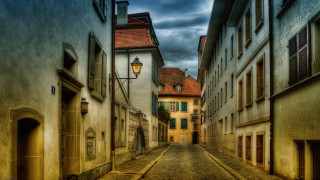 Narrow street lamp post cobblestone - a cobblestone street free wallpaper