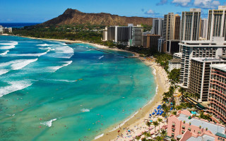 Beach crowd buildings mountain distance - the background and a mountain in the distance free wallpaper