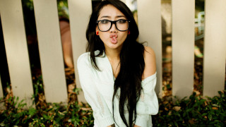 Funny face woman glasses outdoors - her tongue free wallpaper