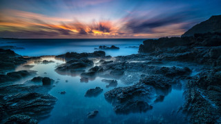 Sunset rocky beach mystical colors 7 - a sunset over a rocky beach free wallpaper