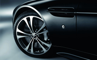 Car wheel closeup black white - a black car free wallpaper