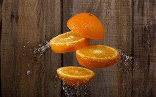 Oranges falling into water wooden - a group of oranges free wallpaper