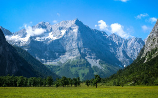 Mountain range grassy field trees 2 - carl hoppe free wallpaper