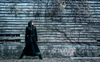 Woman black coat building tree - neo free wallpaper