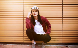 Woman ledge baseballcap redjacket blackpants - a red jacket free wallpaper for desktop