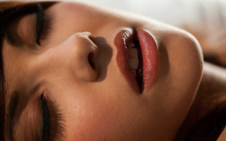 Sleeping woman closeup photorealistic face - shaded free wallpaper