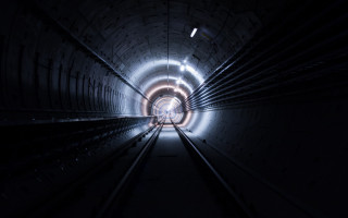 Dark tunnel light train track - a dark tunnel free wallpaper
