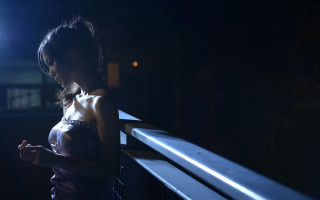 Woman balcony cellphone dark bright - a balcony free wallpaper