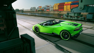 Green sports car driving cargo - a green sports car free wallpaper