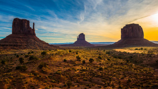 Desert rocks trees cloudy sky - a desert landscape free wallpaper