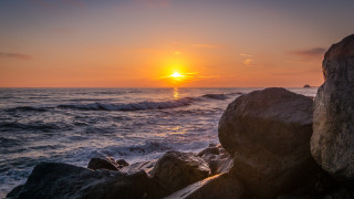 Sunset ocean rocks waves person 2 - rock free wallpaper for desktop