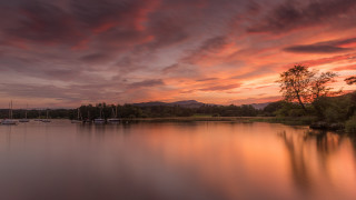 Lake sunset boat clouds trees - rich moody colours free wallpaper