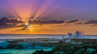 Sunset ocean lighthouse waves building - a lighthouse free wallpaper