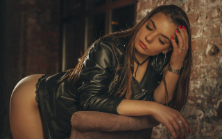 Woman leather jacket closed eyes - a leather jacket free wallpaper