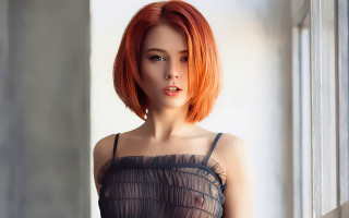 Red hair woman window sill - a curtain behind her free wallpaper for desktop