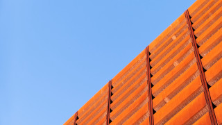 Red building blue sky plane - a red building free wallpaper