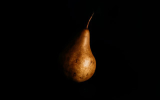 Black pear photorealism dark background - the left side of the image free wallpaper