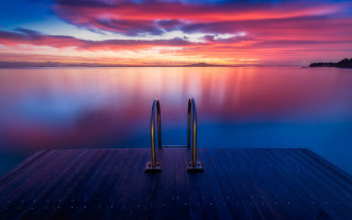 Dock metal poles sunset colorful - a colorful sky free wallpaper
