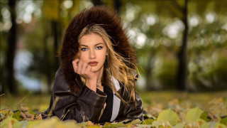 Woman leaves park fur hood - the ground in a park free wallpaper