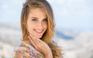 Woman smiling mountain blue sky - facial feature free wallpaper