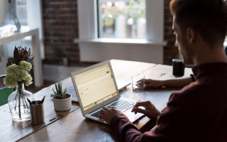 Man laptop table plant cactus - hard focus free wallpaper