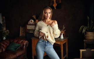 Woman blonde sweater jeans livingroom - a couch and a table free wallpaper