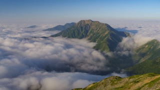 Mountain clouds horizon ocean sunset - cloud below free wallpaper