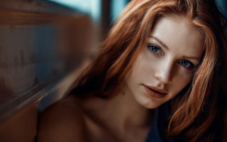 Red haired woman portrait blue 2 - against a wall free wallpaper