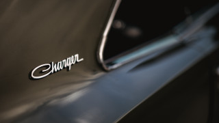 Car logo closeup black background - douglas shuler free wallpaper