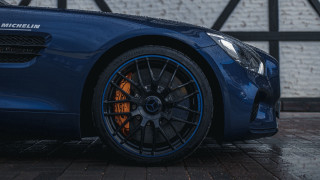 Blue sports car brick wall 2 - rim free wallpaper
