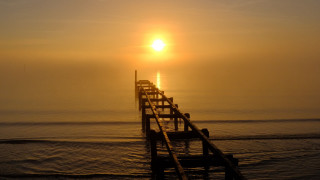 Pier bench sunset boat ocean - a pier free wallpaper