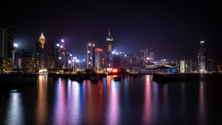 City skyline night water boat 6 - a boat in the foreground free wallpaper for desktop