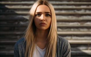 Woman blonde hair serious look 2 - free vintage wallpaper