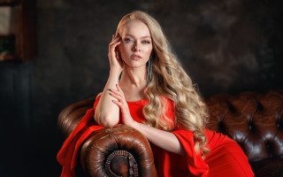 Woman reddress blonde blueeyes portrait - a brown chair free wallpaper