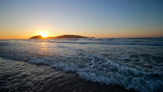 Sunset ocean waves island mountain 2 - a small island in the distance free wallpaper