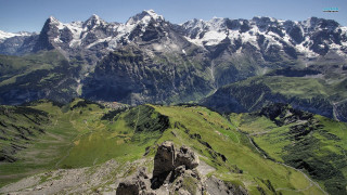 Mountain range valley snow capped - a valley below free wallpaper