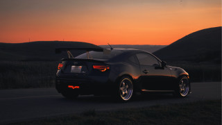 Car sunset hills backlit photorealistic - the side of a road free wallpaper