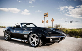 Black sports car road sky 2 - a black sports car free wallpaper