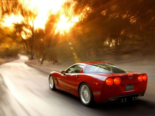 Red sports car driving road 30 - motion blur free wallpaper